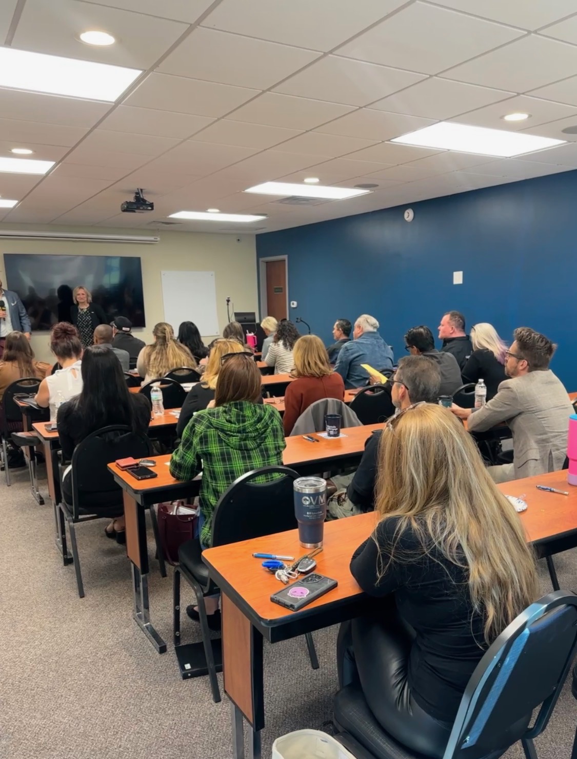 A classroom of participants attending a training session